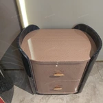Curved High-Gloss Nightstand with Textured Drawer Panels and Oval Pulls